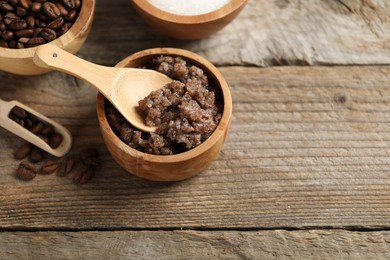 Photo of Natural body scrub and ingredients on wooden table, above view. Space for text