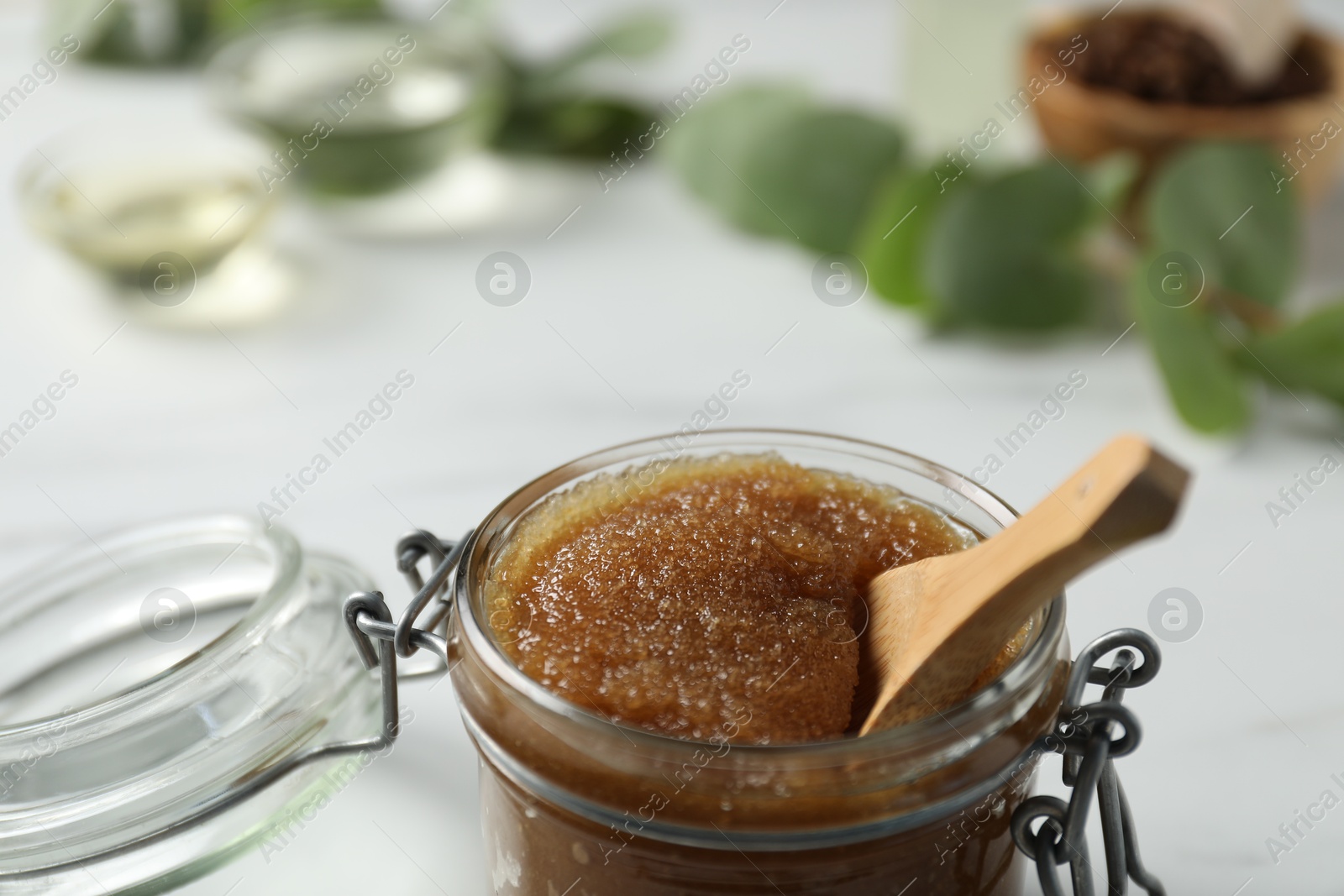 Photo of Natural body scrub on white table, closeup