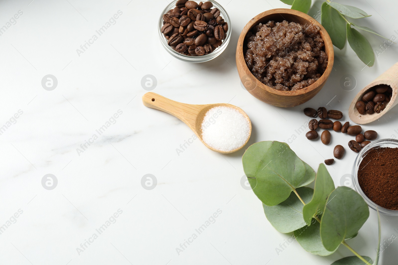 Photo of Natural body scrub and ingredients on white table, flat lay. Space for text