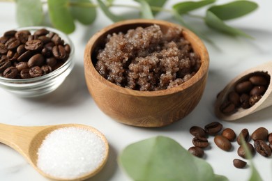 Photo of Natural body scrub and ingredients on white table, closeup
