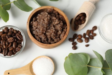 Photo of Natural body scrub and ingredients on white table, flat lay