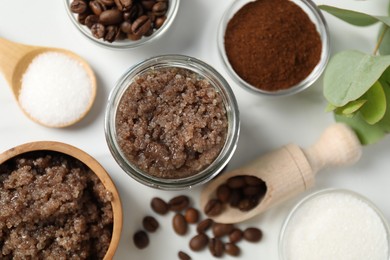 Photo of Natural body scrub and ingredients on white table, flat lay