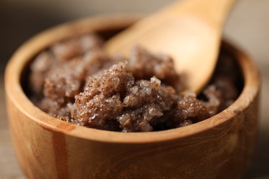 Photo of Natural body scrub on wooden table, closeup