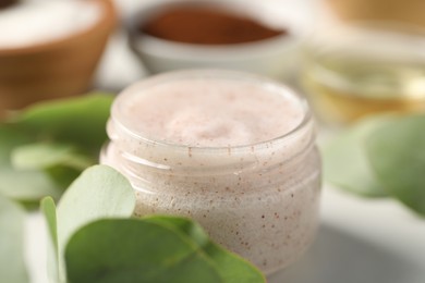 Photo of Natural body scrub on white table, closeup