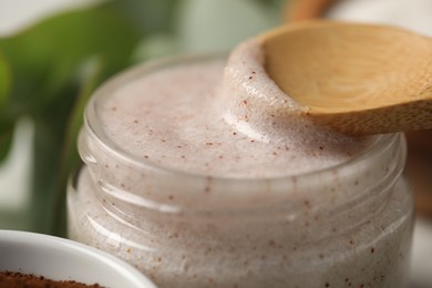 Photo of Natural body scrub on white table, closeup