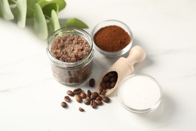 Photo of Natural body scrub and ingredients on white table