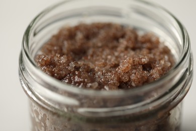 Photo of Natural body scrub on white table, closeup