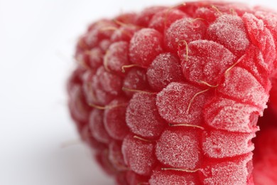 Photo of One frozen raspberry on white background, macro view
