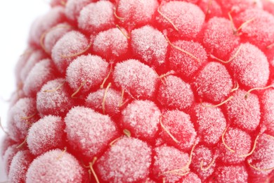 Photo of One frozen raspberry on white background, macro view