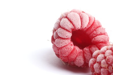 Photo of Frozen raspberries on white background, macro view. Space for text