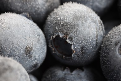Photo of Many frozen blueberries as background, macro view