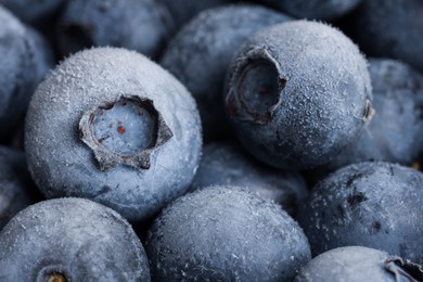 Photo of Many frozen blueberries as background, macro view