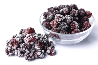 Photo of Many ripe frozen blackberries on white background