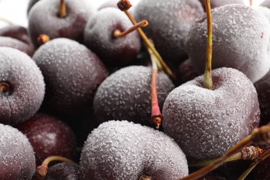 Photo of Closeup view of many ripe frozen cherries