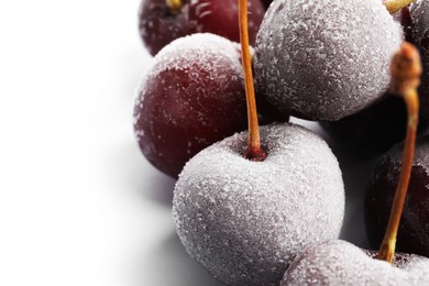 Photo of Many frozen cherries on white background, closeup