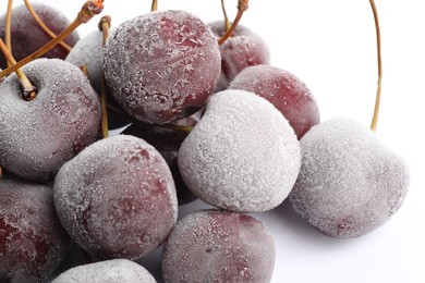 Photo of Many frozen cherries on white background, closeup