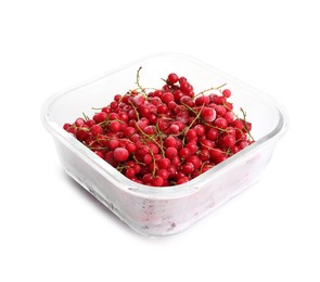 Photo of Frozen currants in glass container isolated on white