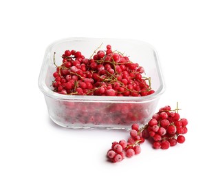 Photo of Frozen currants in glass container isolated on white