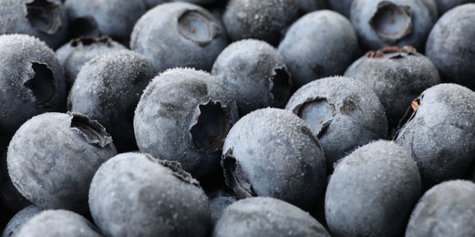 Photo of Heap of frozen blueberries as background, closeup