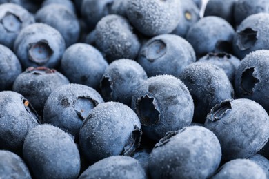 Photo of Heap of frozen blueberries as background, closeup