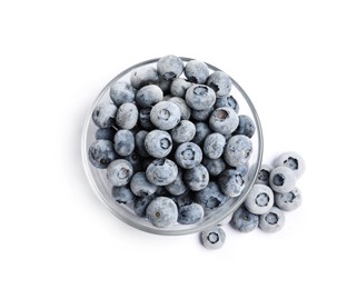 Photo of Frozen blueberries in glass bowl isolated on white, top view