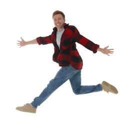 Photo of Portrait of happy young man jumping on white background