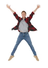 Photo of Portrait of happy young man jumping on white background