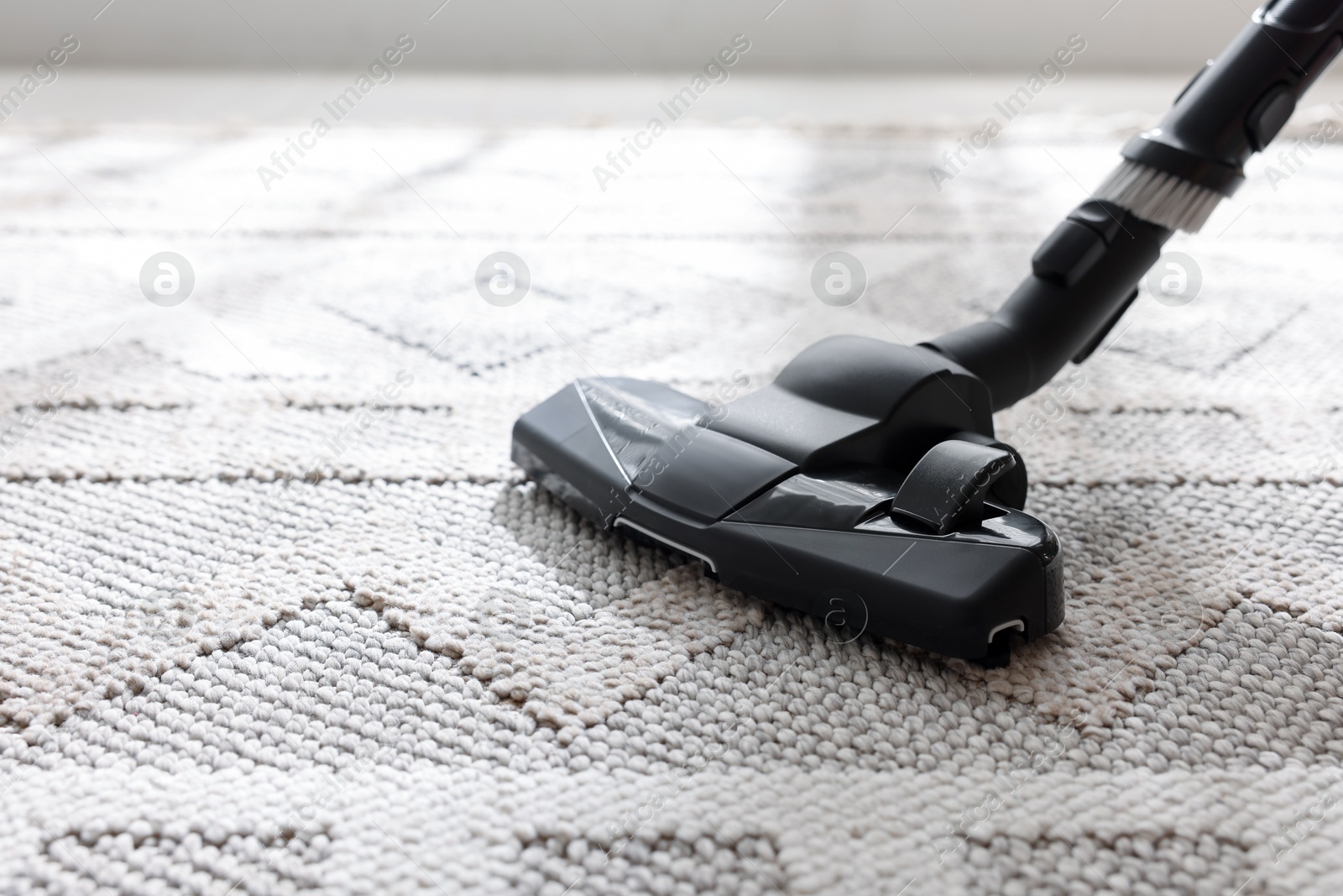 One vacuum cleaner nozzle on carpet indoors, closeup. Space for text Photo of One vacuum cleaner nozzle on carpet indoors, closeup. Space for text