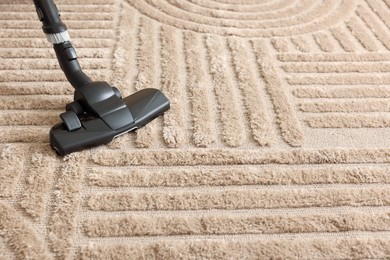 Photo of One vacuum cleaner nozzle on carpet, space for text