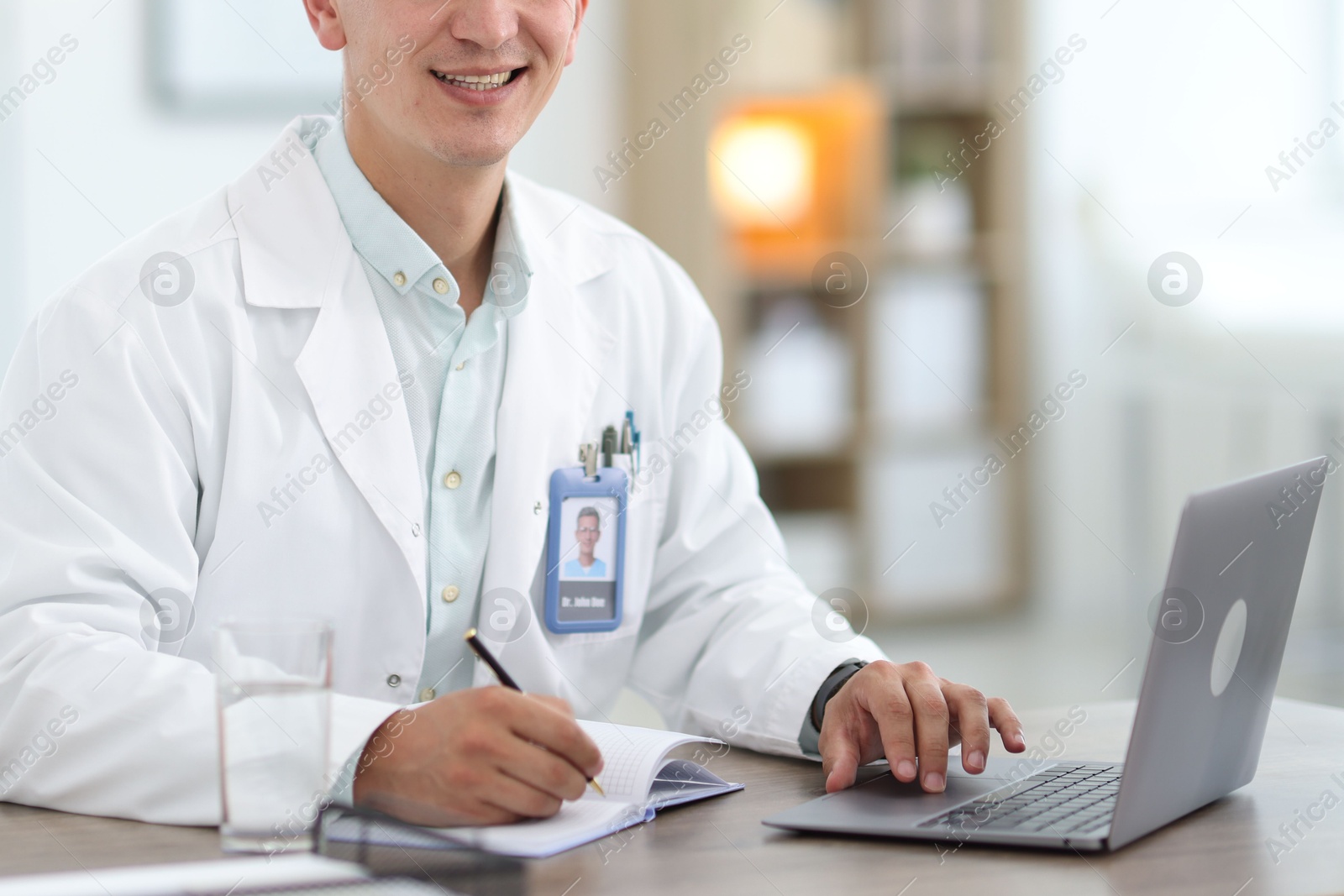 Telemedicine. Doctor having video call with patient via laptop indoors, closeup Photo of Telemedicine. Doctor having video call with patient via laptop indoors, closeup
