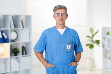 Photo of Portrait of doctor in scrubs at clinic