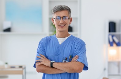 Photo of Portrait of doctor in scrubs at clinic