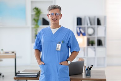 Photo of Portrait of doctor in scrubs at clinic