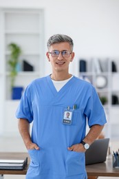 Photo of Portrait of doctor in scrubs at clinic