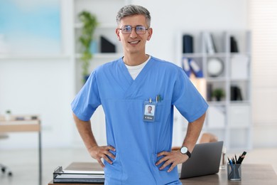 Photo of Portrait of doctor in scrubs at clinic