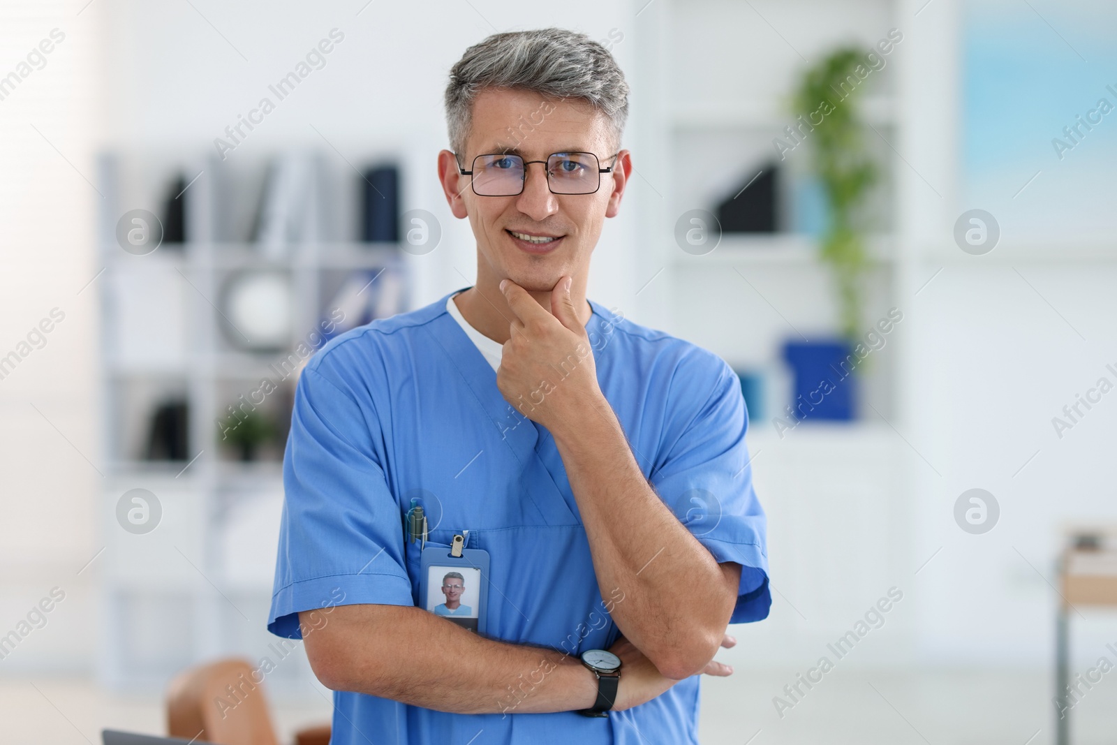 Photo of Portrait of doctor in scrubs at clinic