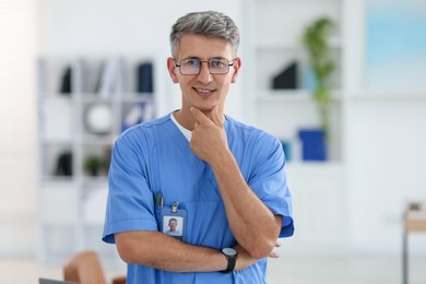 Photo of Portrait of doctor in scrubs at clinic