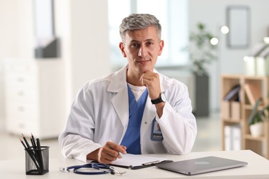Photo of Telemedicine. Doctor having video call with patient, view from camera