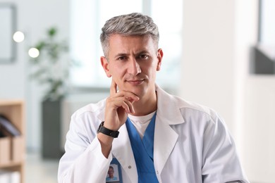 Photo of Telemedicine. Doctor having video call with patient, view from camera