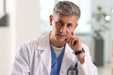 Photo of Telemedicine. Doctor having video call with patient, view from camera