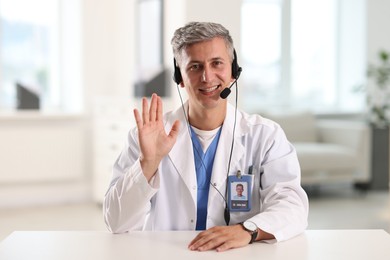 Photo of Telemedicine. Doctor having video call with patient, view from camera