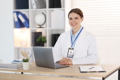 Photo of Telemedicine. Doctor having video call with patient via laptop indoors