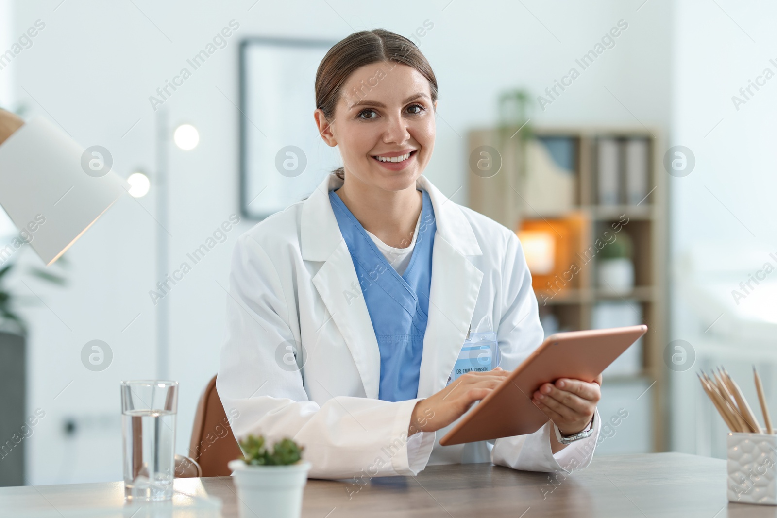 Photo of Telemedicine. Doctor having video call with patient via tablet indoors