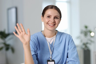 Photo of Telemedicine. Doctor having video call with patient, view from camera
