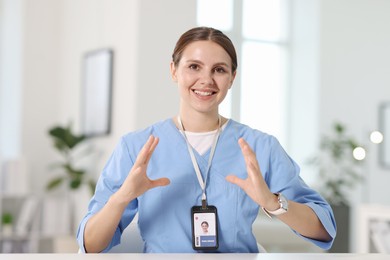 Photo of Telemedicine. Doctor having video call with patient, view from camera