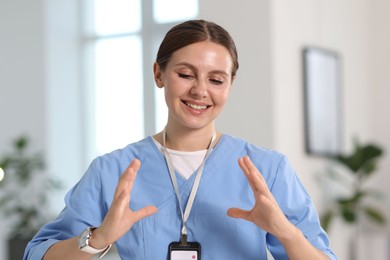 Photo of Telemedicine. Doctor having video call with patient, view from camera
