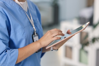 Photo of Telemedicine. Doctor with tablet in office, closeup