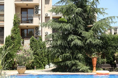Photo of Sveti Vlas, Bulgaria - July 14, 2025: Swimming pool and different green plants near hotel at luxury resort