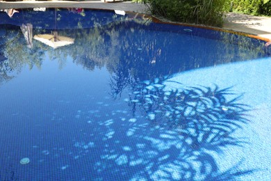 Photo of Outdoor swimming pool with clear water on sunny day