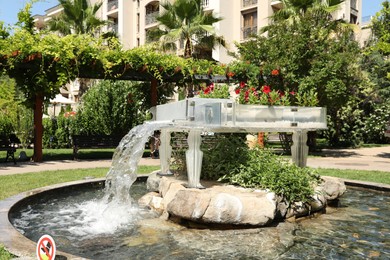 Photo of Sveti Vlas, Bulgaria - July 14, 2025: Piano shaped fountain decorated with flowers in park